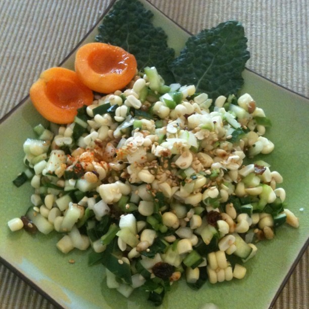 Tasty summer salad: fresh Brentwood corn, dinosaur kale, toasted pine nuts, cucumber with a sesame ginger raisin dressing