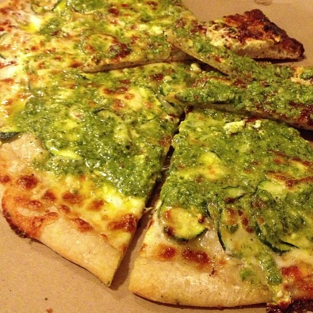 What everyone is waiting for – zucchini, onions, French feta cheese, mozzarella, basil pesto and pine nuts. $10 for 1/2 pizza.